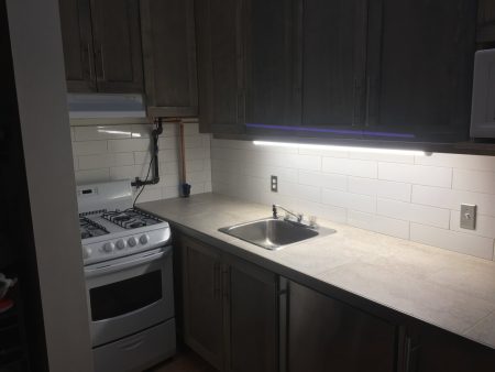 Subway Tile Backsplash and Tile Kitchen Countertop with Schluter profile Edge - Fernwood Village Apts.