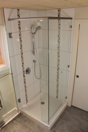 Corner Shower with Vertical Mosaic Tile Accent Bands - Oak Bay