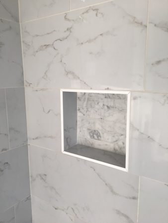 White Tile Walk In Shower with Black Floor and Niche Box Detail - Monterey