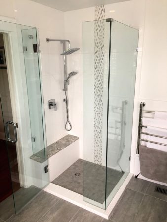 Corner Shower with Stone Bench Top and Vertical Mosaic Tile Band - Feltham