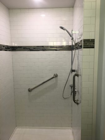 Subway Tile Shower with Glass Mosaic Tile Accent Band and Grab Bar - Brentwood 