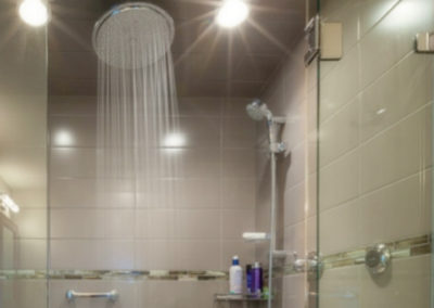 Walk In Steam Room Shower with Bench and Glass Mosaic Tile Accent Bands - Lansdowne - Times Colonist Photo