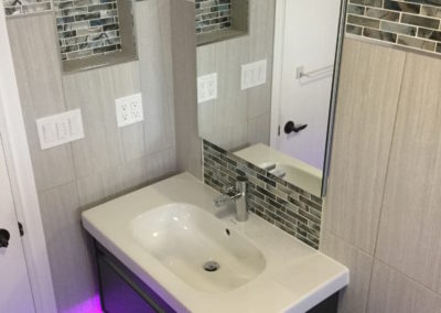 Bathroom Tile with Niche Box, Mosaic Accent Band Framed With Schluter Quadec and Undermount LED Lit Vanity - Quadra