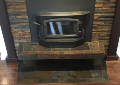 Slate and Ledgestone Fireplace Surround and Hearth with Wood Stove Insert - Victoria BC