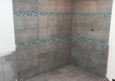 Walk In Shower with 3 Blue Glass Mosaic Tile Accent Bands and Tileable Line Drain - Lands End Rd.