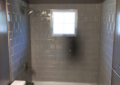 Grey Bevelled Tile Shower with Window - Ross Bay