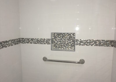 Subway Tile Shower with Glass Mosaic Tile Accent Band, Niche Box and Grab Bar - Broadmead